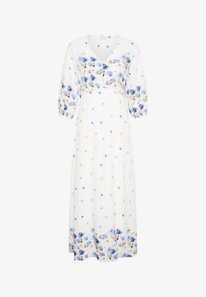 Biała sukienka midi z niebieskim kwiatowym wzorem, z bufiastymi rękawami do połowy przedramienia, dekoltem w kształcie litery V oraz zdobieniami w formie guzików na wysokości klatki piersiowej.