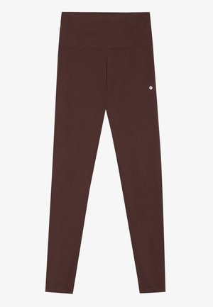 Leggings marron en matériau extensible, avec une taille haute, un design sans couture et un petit logo près de la hanche gauche.