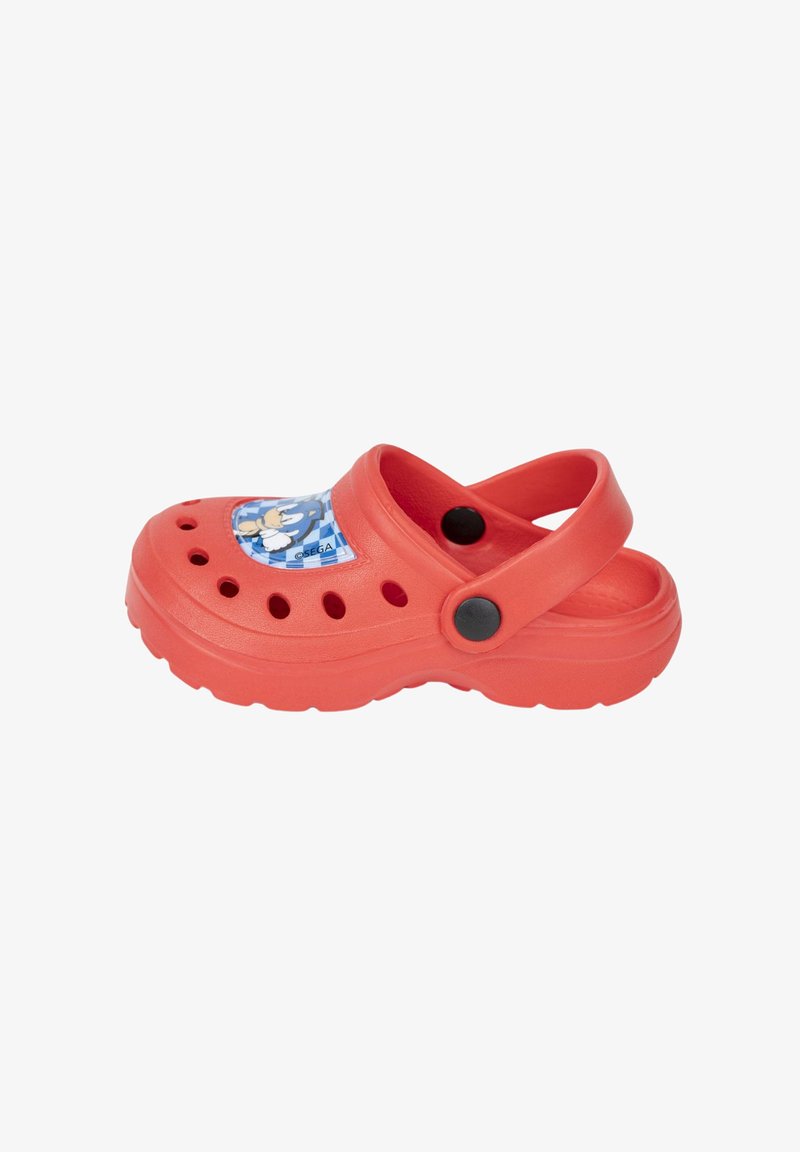 Red synthetic clogs with a blue graphic patch featuring a character, ventilation holes, raised sole, and black button accents.