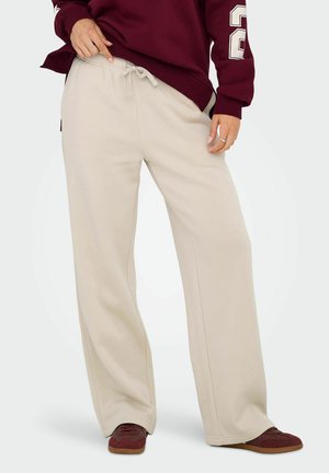 Beige Sweatpants aus weichem Material, mit einem elastischen Bund und Kordelzug, geradem Bein und Seitentaschen.