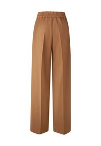 Bruine, brede broek van textuurstof. Voorzien van een elastische tailleband en plooien voor extra stijl en comfort.