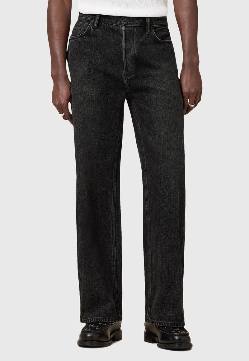Schwarze Jeans aus Denim mit geradem Schnitt, mittelhoher Taille und klassischem Fünf-Taschen-Design. Verfügt über subtile Textur- und Nahtdetails.