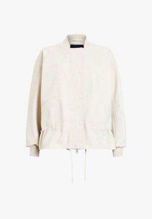 Giacca bomber color crema con un frontale testurizzato, bottoni a pressione, tasche laterali, maniche elasticizzate e orlo con coulisse.