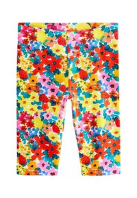 Virágmintás leggings, színes mintával, piros, rózsaszín, zöld és sárga virágokkal egy világos sárga háttéren. Nyújtható anyag, félvádli hosszúság.