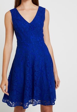 Blue lace dress with a V-neck, sleeveless design, fitted waist, and flared skirt. Features floral patterns and a textured, sheer finish.