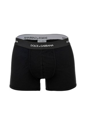 Zwarte geribbelde boxershorts met een elastische tailleband met merknaam "Dolce & Gabbana" in witte letters.