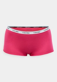 Růžové bavlněné boxerky s černým elastickým pasem, na kterém je bíle vytištěné logo "Calvin Klein". Hladký, bezešvý design bez vzorů.