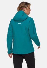 Giacca impermeabile turchese con cappuccio, polsini elasticizzati e design semplice. Presenta un logo sul retro. Adatta per attività all'aperto.