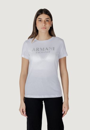 T-shirt bianco in cotone con maniche corte e scollatura rotonda, con il logo argentato "ARMANI EXCHANGE" impreziosito sul davanti.