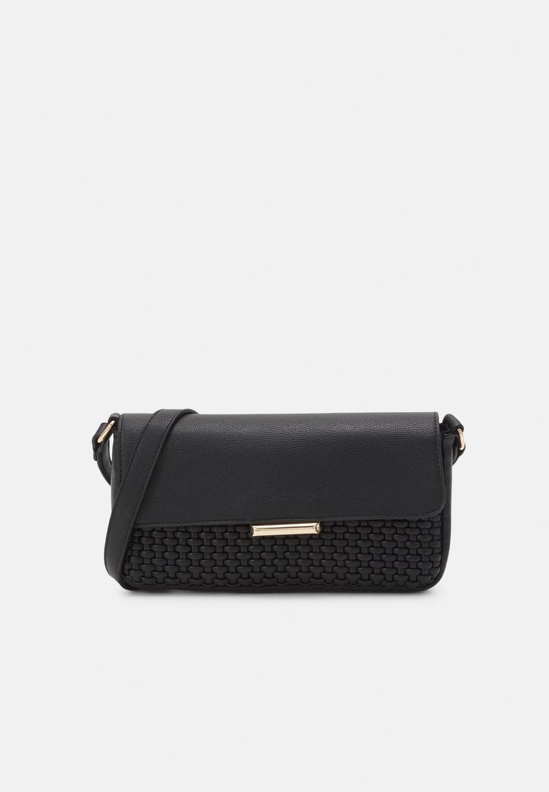 Black shoulder bag with woven textured lower half, smooth flap, gold rectangular clasp, and adjustable strap on white background.