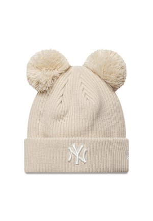 Beige knit winter hat with two pom-poms on top and white embroidered NY logo on the folded cuff.