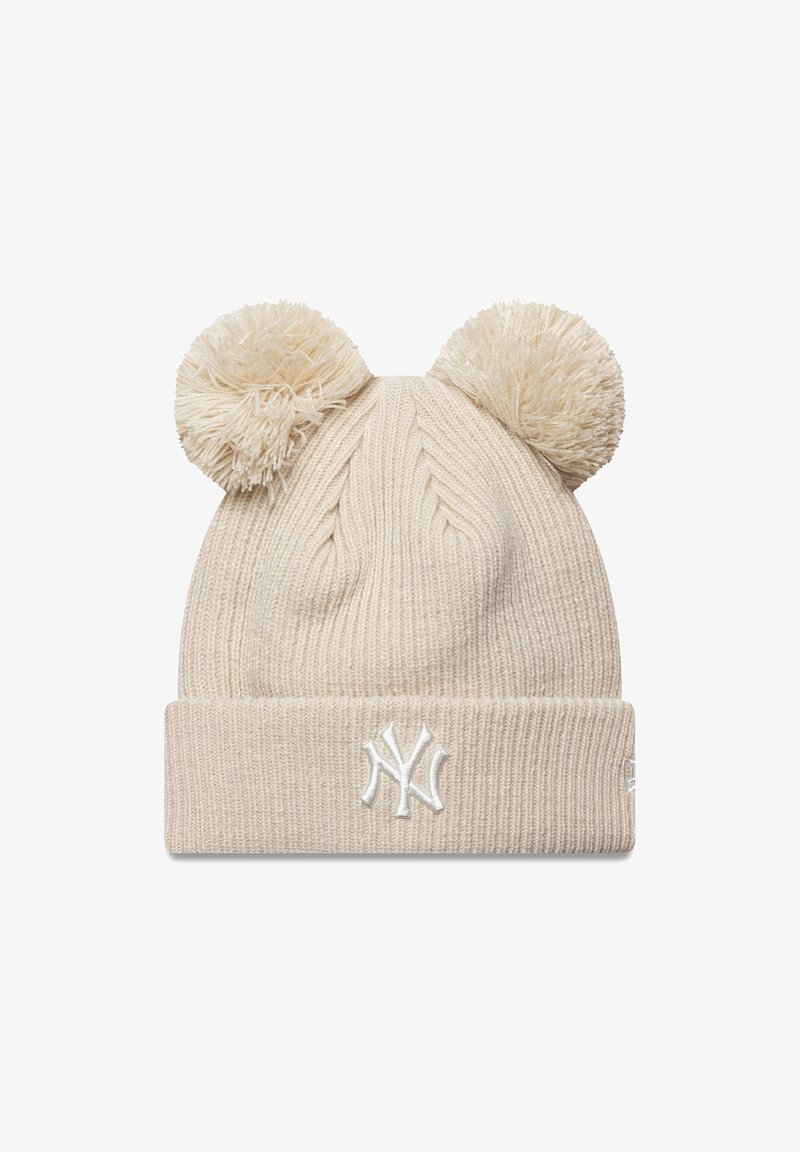 Beige knit winter hat with two pom-poms on top and white embroidered NY logo on the folded cuff.