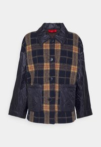 Rutig ulljacka i marinblått, beige och vinröd med en kviltad nylonärm, fyra knappar och två framfickor.