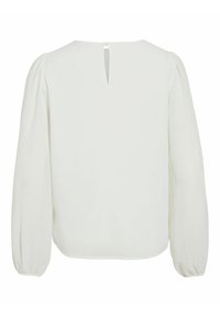 Blusa bianca con scollo tondo e apertura a occhiello sul retro. Presenta maniche lunghe a sbuffo e polsini elastici. Texture del tessuto liscia.