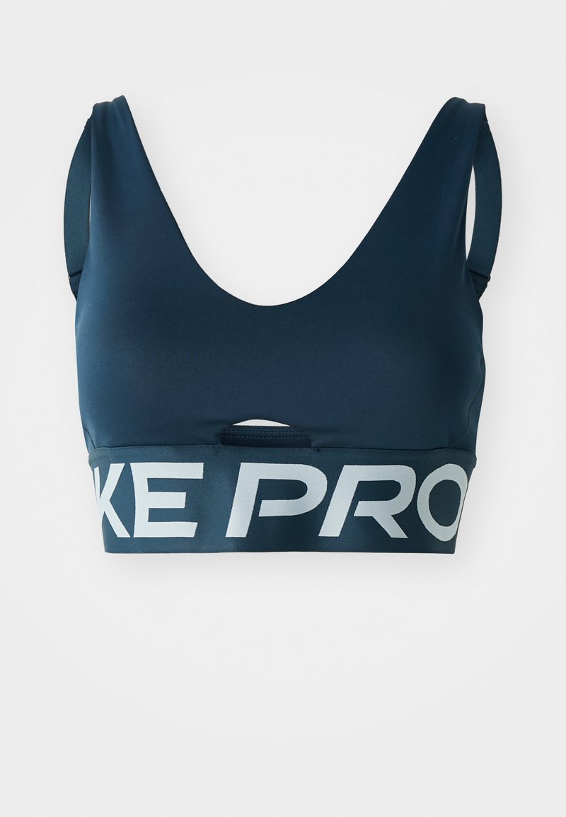 Navyblauer Sport-BH aus dehnbarem Stoff mit weitem Ausschnitt und breiten Trägern. Auf dem Bund befindet sich ein auffälliges "NIKE PRO"-Logo.