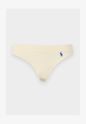 Γυναικεία μπικίνι σε κρεμ χρώμα με μικρό μπλε κεντημένο λογότυπο στο αριστερό ισχίο, σε λευκό φόντο.