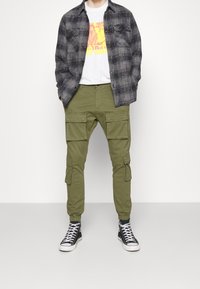 Pegador Kapsáče - olive