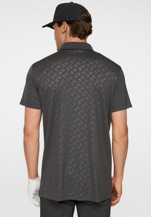 Men's short-sleeve polo in dark gray with a subtle geometric pattern on the back, featuring a spread collar and lightweight fabric.