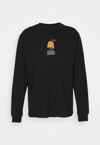 T-shirt nera a maniche lunghe in cotone, con un personaggio arancione ricamato e del testo, dotata di polsini a coste e design a girocollo.