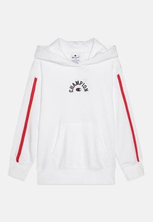 Sudadera blanca con franjas laterales rojas y logo de "Champion". Cuenta con un bolsillo frontal y capucha de doble capa. Tejido suave, mangas largas.