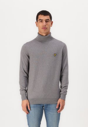 Gray turtleneck sweater made of soft fabric, featuring a small yellow logo on the chest and ribbed detailing at the cuffs and hem.