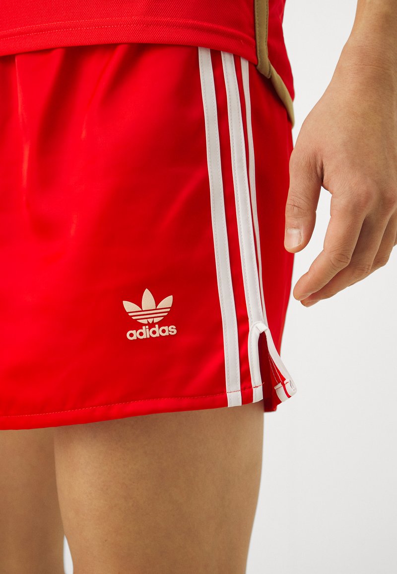 red adidas 3 stripe shorts