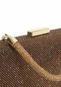 Brown metallic clutch bag featuring a textured surface with small shimmering details, a golden closure, and a clear embellished strap.