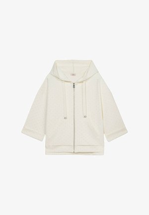 Cream zip-up hoodie with a large hood, short sleeves, and dotted pattern. Features two front pockets and silver hardware accents.