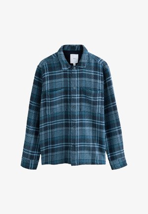 Niebiesko-czarna koszula w kratę z długim rękawem i kołnierzykiem, rozłożona na płasko, ukazująca widok z przodu z kieszeniami na piersi.