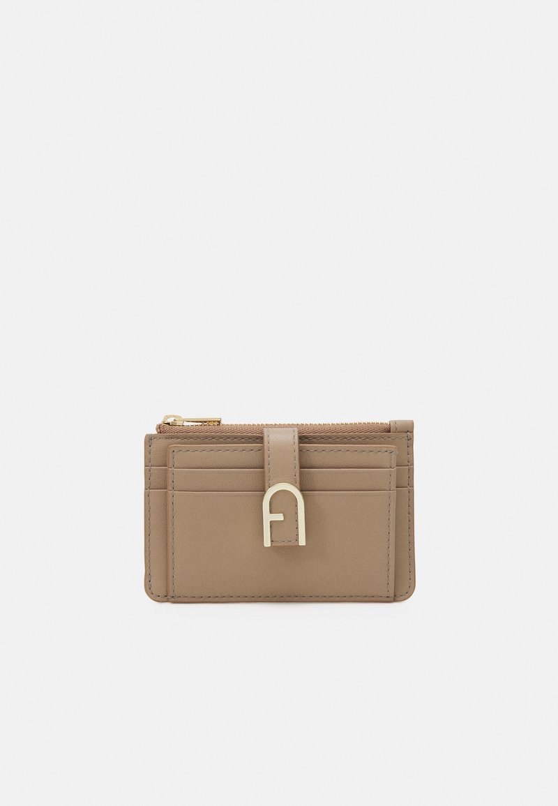 Tan leather cardholder with gold hardware, features a zip pocket and multiple card slots, smooth texture, minimalist design.