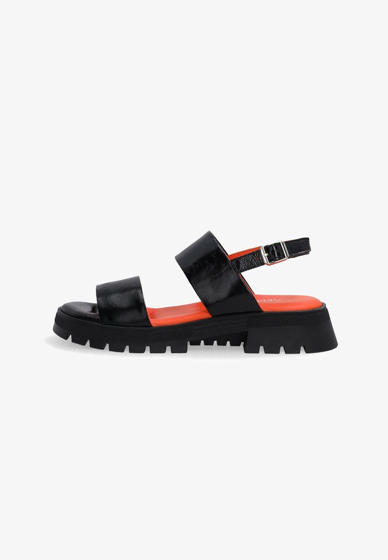 Black leather sandals featuring two wide straps, a chunky black sole, and an orange interior. Adjustable ankle strap with silver buckle.