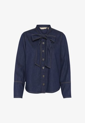 Tamno plavi traper košulja s kragnom na mašnu, dugim rukavima, dugmadi na prednjoj strani i kontrastnim detaljima šivanja. Glatka tekstura.