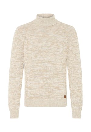 Suéter de punto en tono beige y blanco jaspeado, con mangas largas y cuello alto tipo tortuga, que incluye una pequeña etiqueta de marca marrón cerca del dobladillo.