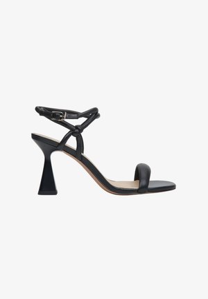 Black leather heeled sandal featuring a triangular heel, slender ankle strap with buckle, and open toe design. Smooth surface and neutral sole.