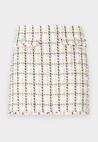 Tweed mini skirt featuring a multicolor check pattern, frayed hem, and two metallic button accents on the front.