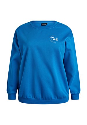 Mėlynas džemperis su storu audiniu. Turi apvalų iškirptę, ilgus rankovus, ribotas rankogalius ir mažą „Club“ logotipą krūtinėje.