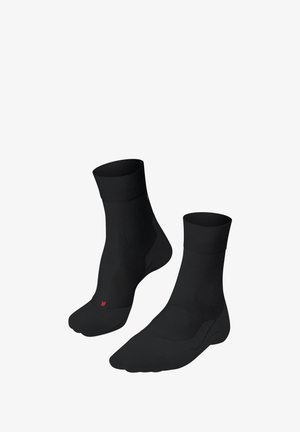 Paar schwarze Knöchel-Strippen-Zehen-Socken mit gerippten Bündchen und roter Markierung für den rechten Fuß auf weißem Hintergrund.