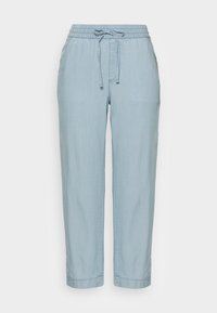 Ljusblåa dragsnörenbyxor i mjukt, texturerat tyg. Har ett elastiskt midjeband och avsmalnande ben med manschetter.