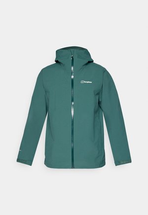 Veste imperméable teal avec capuche, fermeture éclair sur l'ensemble du devant et logo sur la poitrine gauche. Elle possède des manches longues et des poignets ajustables.