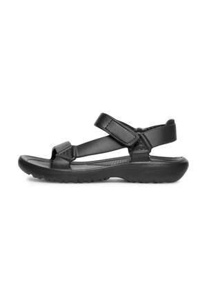 Schwarze Sandalen mit verstellbaren Riemen, einer strukturierten Gummisohle und einem gepolsterten Fußbett, das ein minimalistisches Design und eine offene Zehenpartie aufweist.