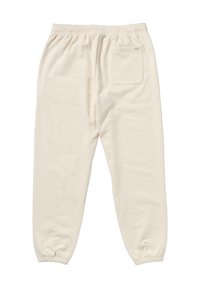 Cremefarbene Sweatpants aus weichem Stoff, mit einem elastischen Bund, schmal zulaufenden Knöcheln und einer hinteren Tasche.