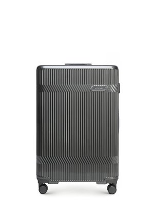 Valise rigide gris foncé avec des rainures verticales, quatre roues multidirectionnelles et une poignée supérieure, marquée "Wittchen" à l'avant.