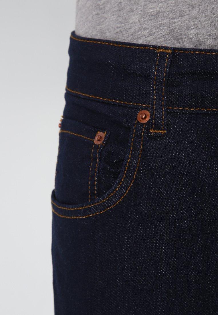 one black leg one white leg jeans