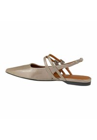 Pointed toe flat shoe in light beige matte leather, featuring crisscross straps and an open back, with a brown interior and black sole.