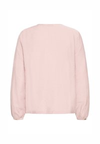 Light pink long-sleeve blouse with round neckline and buttoned cuffs shown from the back on a white background.