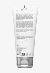 Tubetto di plastica bianco con tappo trasparente, etichettato in più lingue. Contiene istruzioni per l'uso e dettagli del prodotto stampati in nero.