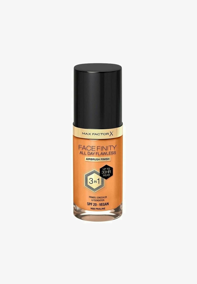 Max Factor Face Finity All Day Flawless foundation i en cylindrisk glasflaska med en orange gradien, svart lock och guldaccenter.