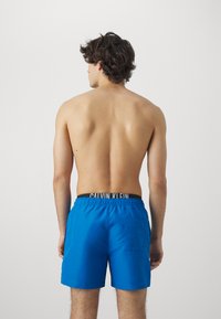 Calvin Klein Swimwear MEDIUM DOUBLE - Plaukimo šortai - faience blue