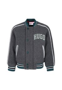 Grijze wollen bomberjack met witte en groene accenten, voor knopen, geribde manchetten en "HUGO" geborduurd op de borst.