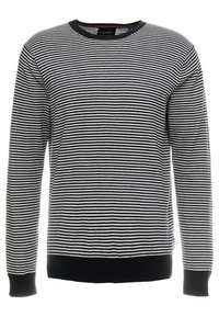 Maglione a maniche lunghe a strisce bianche e nere, con scollo rotondo e polsini e orlo in maglina nera. Realizzato in un materiale morbido e testurizzato.